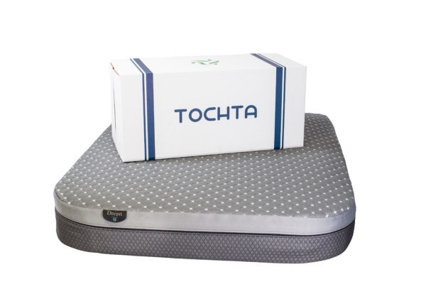 tochta box sitting on top of divini mattress
